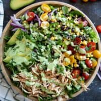 Southwest chicken salad with tomatoes, corn, black beans, onions, and shredded chicken.