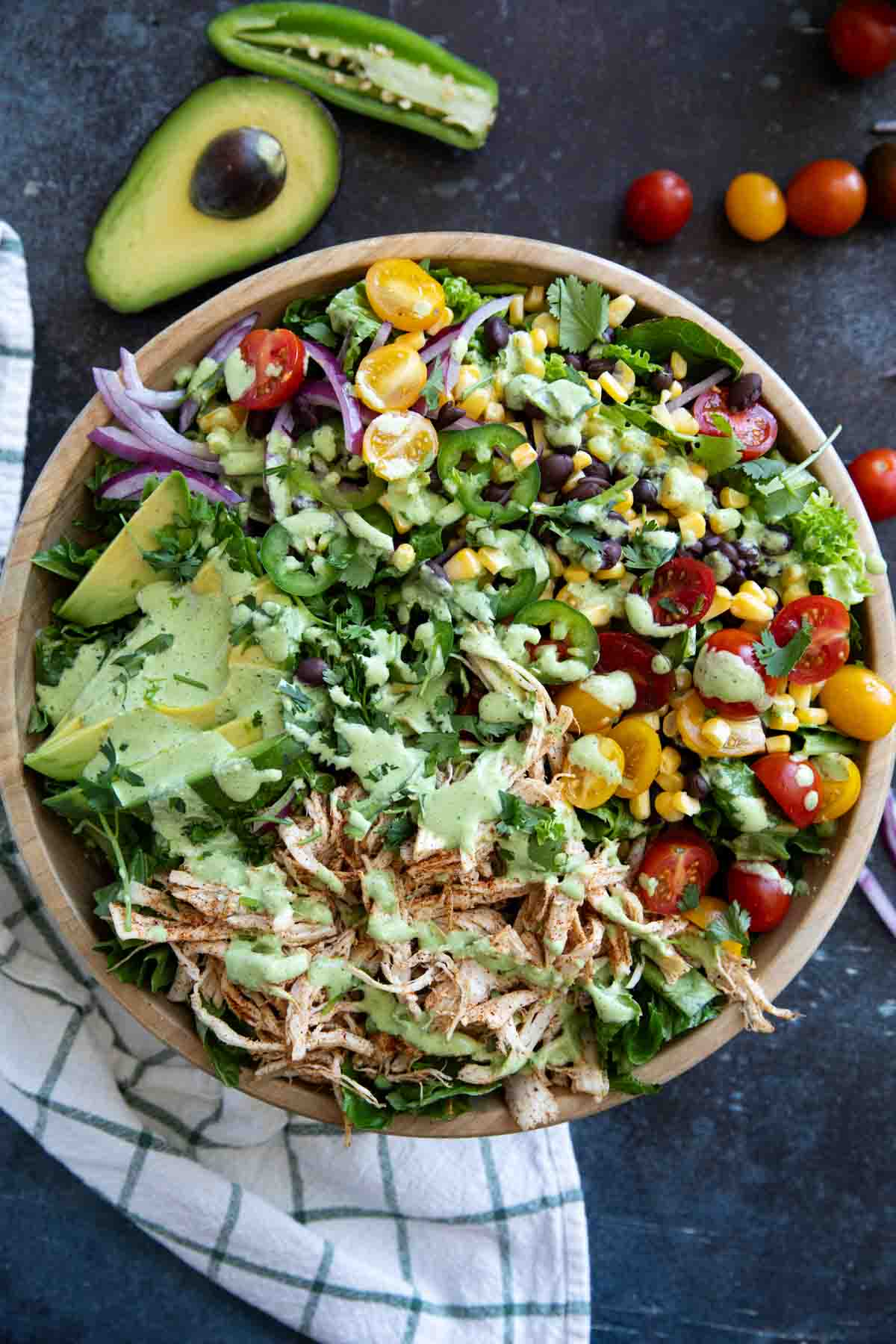 Southwest chicken salad with tomatoes, corn, black beans, onions, and shredded chicken.