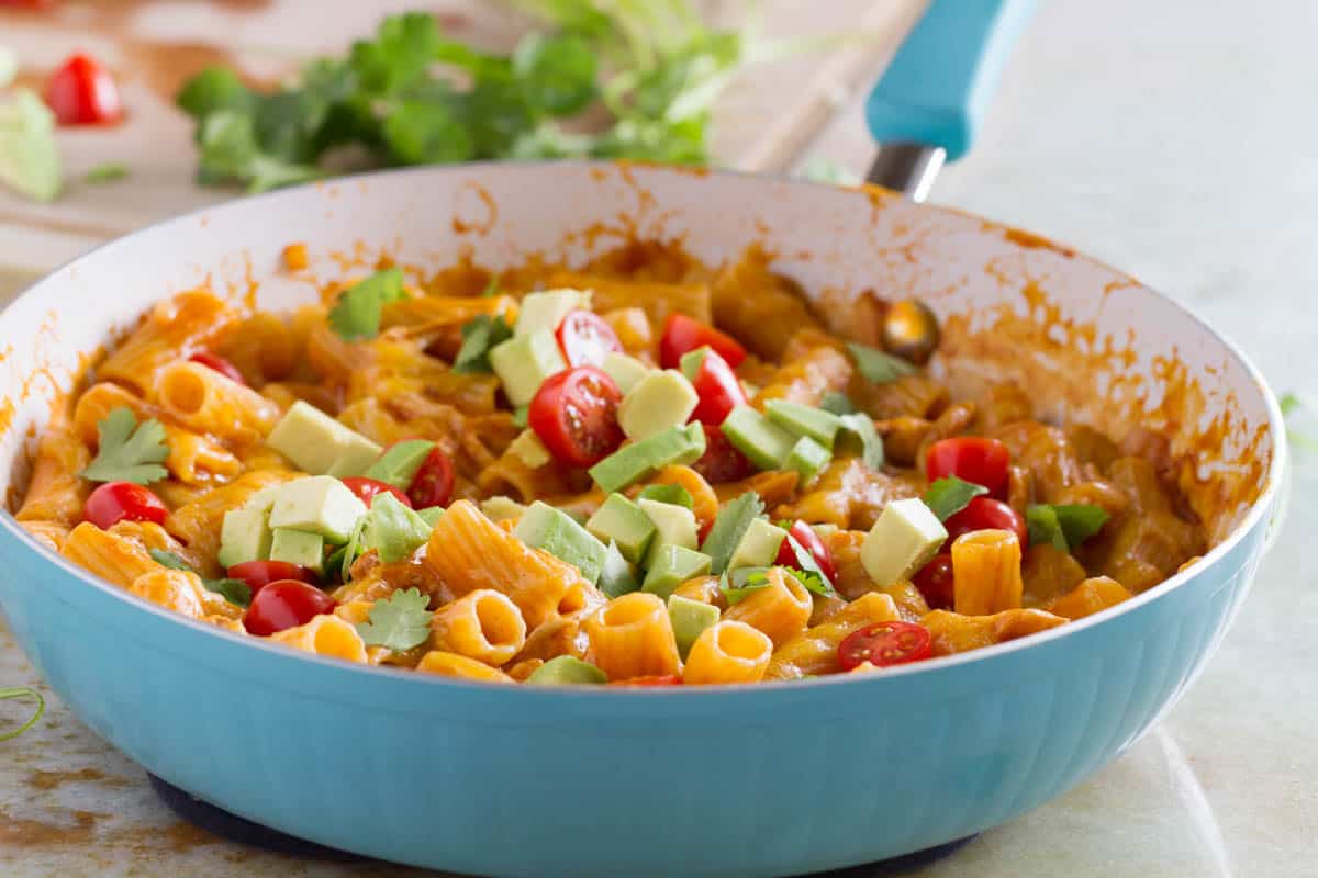 Skillet filled with enchilada pasta - an easy weeknight dinner.