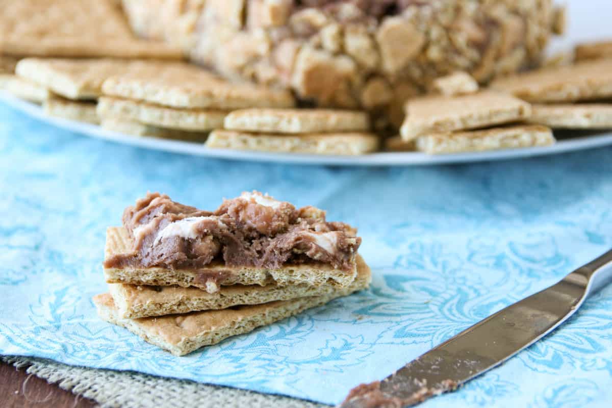 S'mores cheese ball spread on a graham cracker piece.