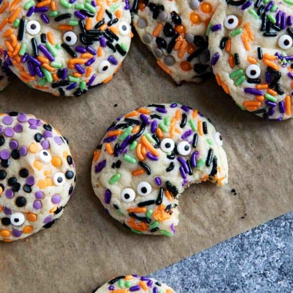 Halloween cookies with different halloween sprinkles and candy eyeballs.