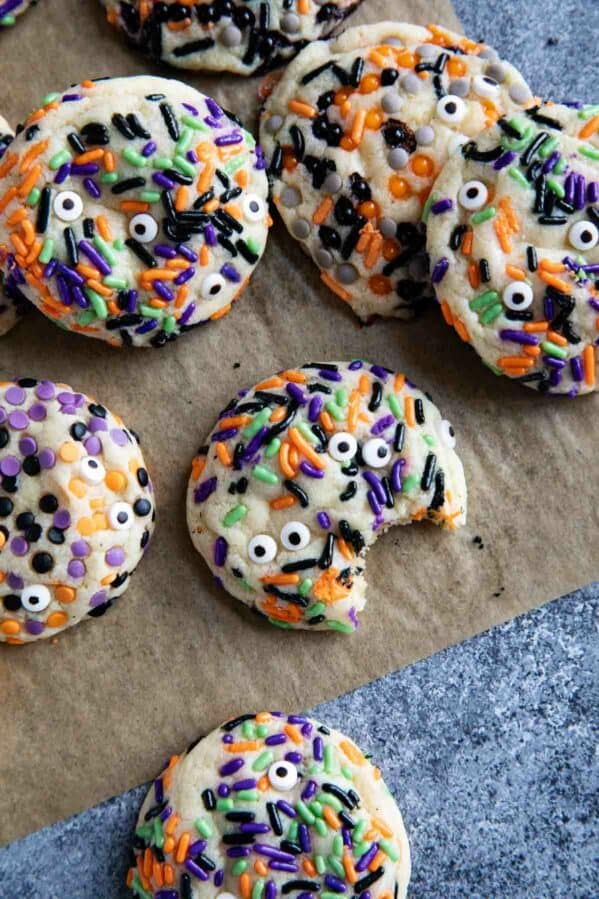 Halloween cookies with different halloween sprinkles and candy eyeballs.