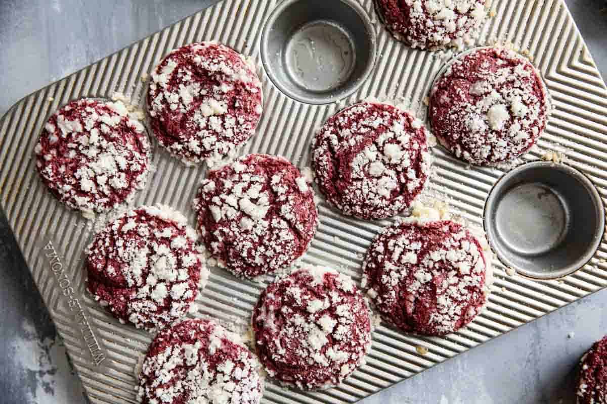 Red Velvet Muffins with streusel topping in a muffin tin.