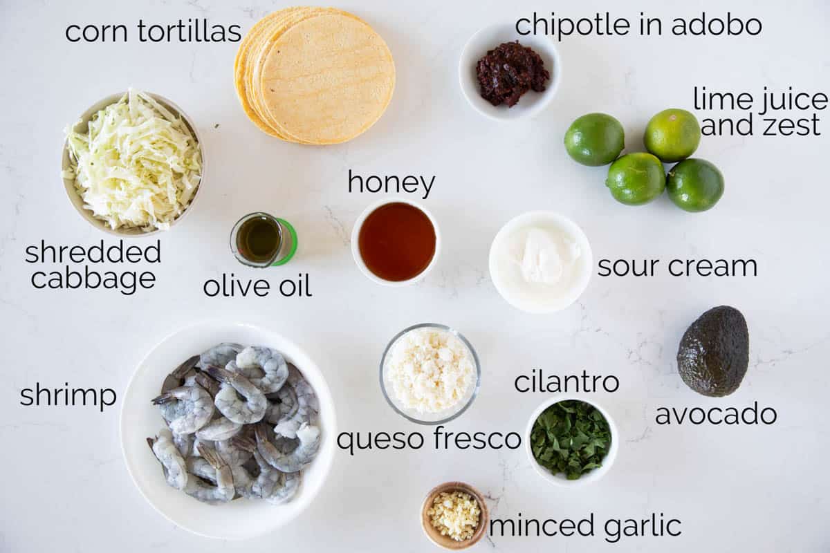 Ingredients needed to make shrimp tacos with chipotle lime crema.