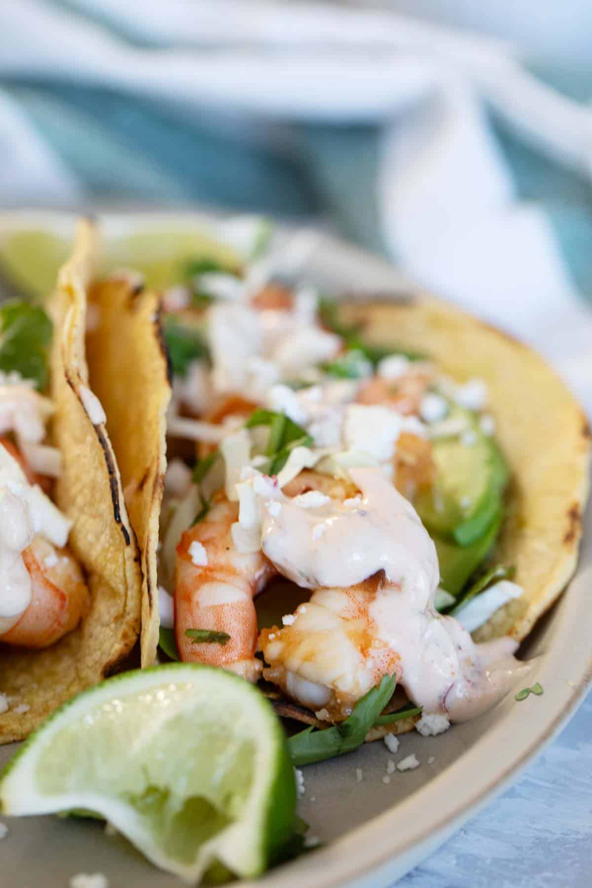 Tacos with shrimp and a chipotle lime crema on top.