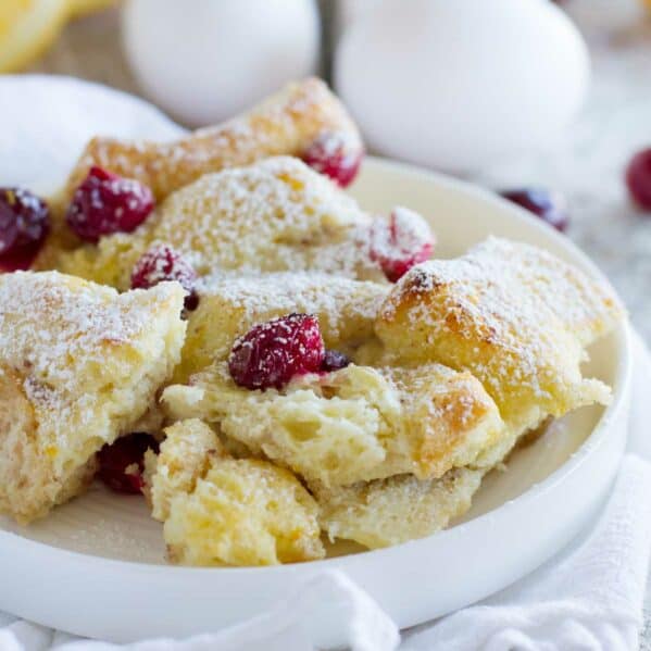 Cranberry Orange Baked French Toast Casserole on a plate, made with fresh cranberries and oranges.
