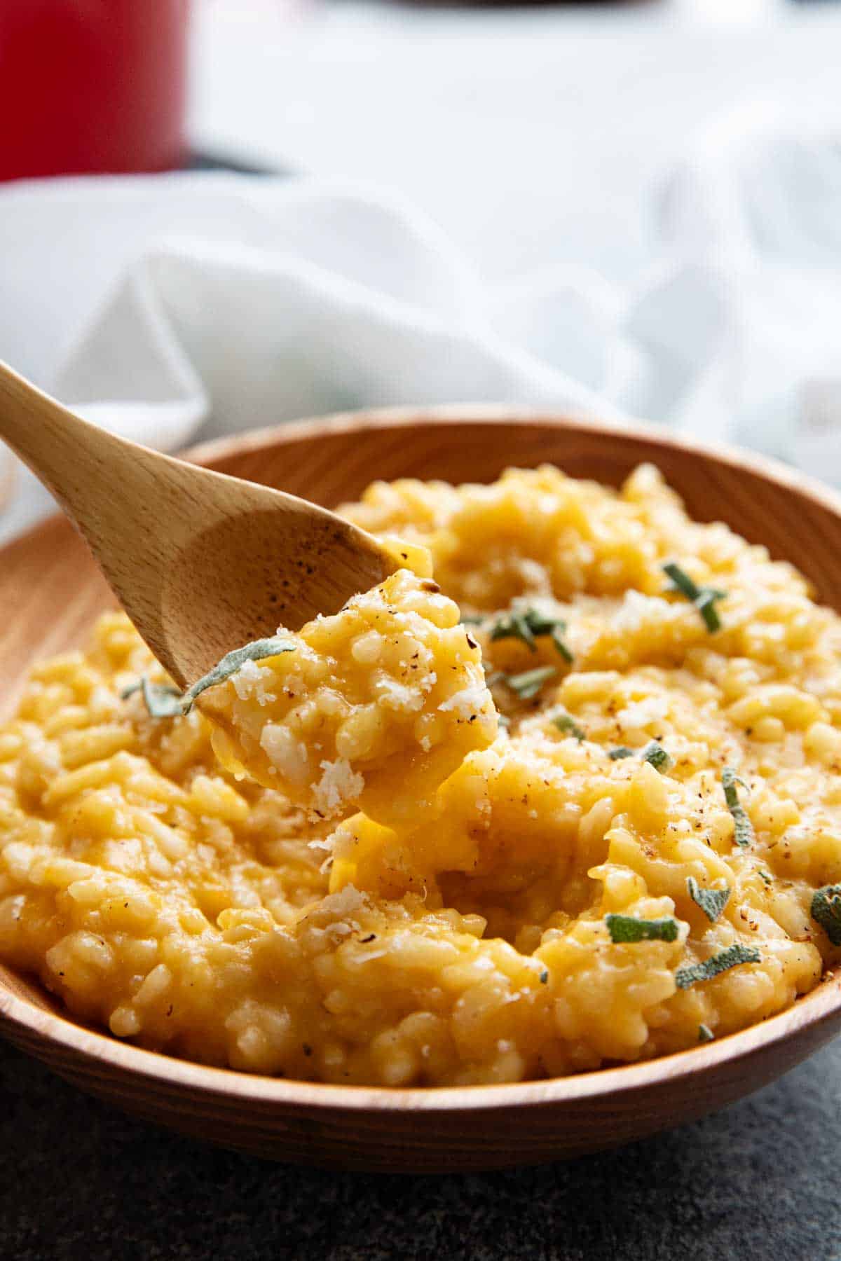 Butternut Squash Risotto with some in a wooden spoon.