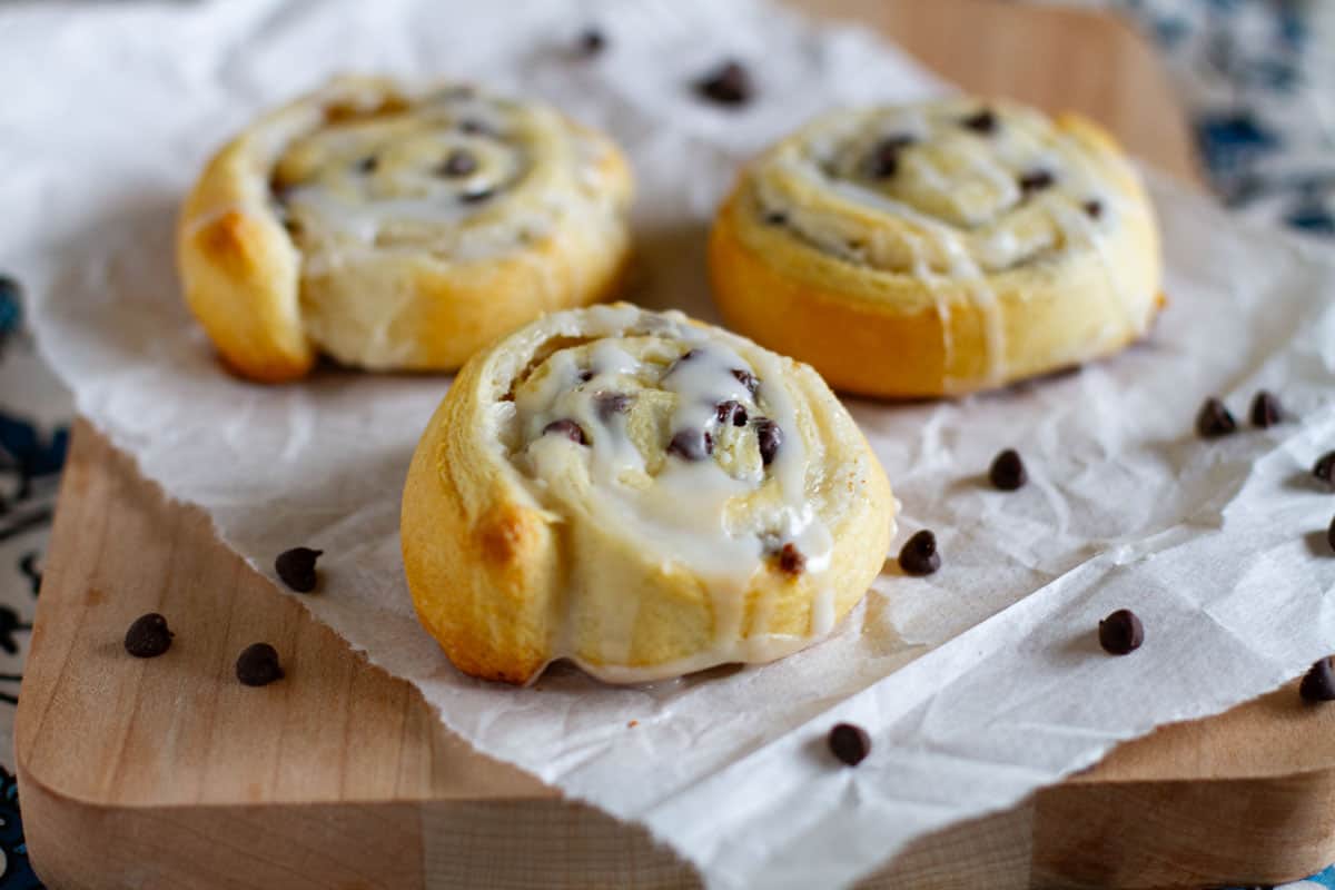 Chocolate Chip Crescent Roll Cookies filled with cream cheese and chocolate chips and topped with a simple glaze.