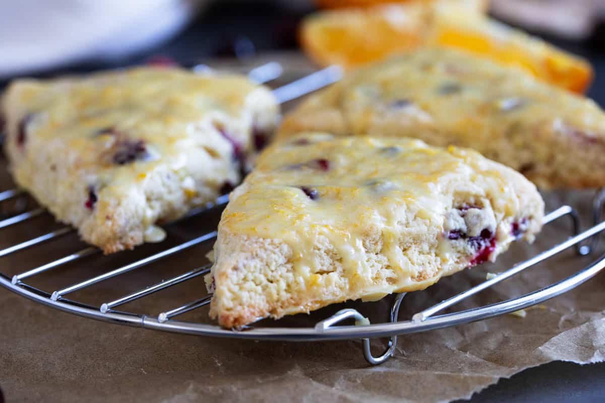 Cranberry orange scones on a cooling rack.