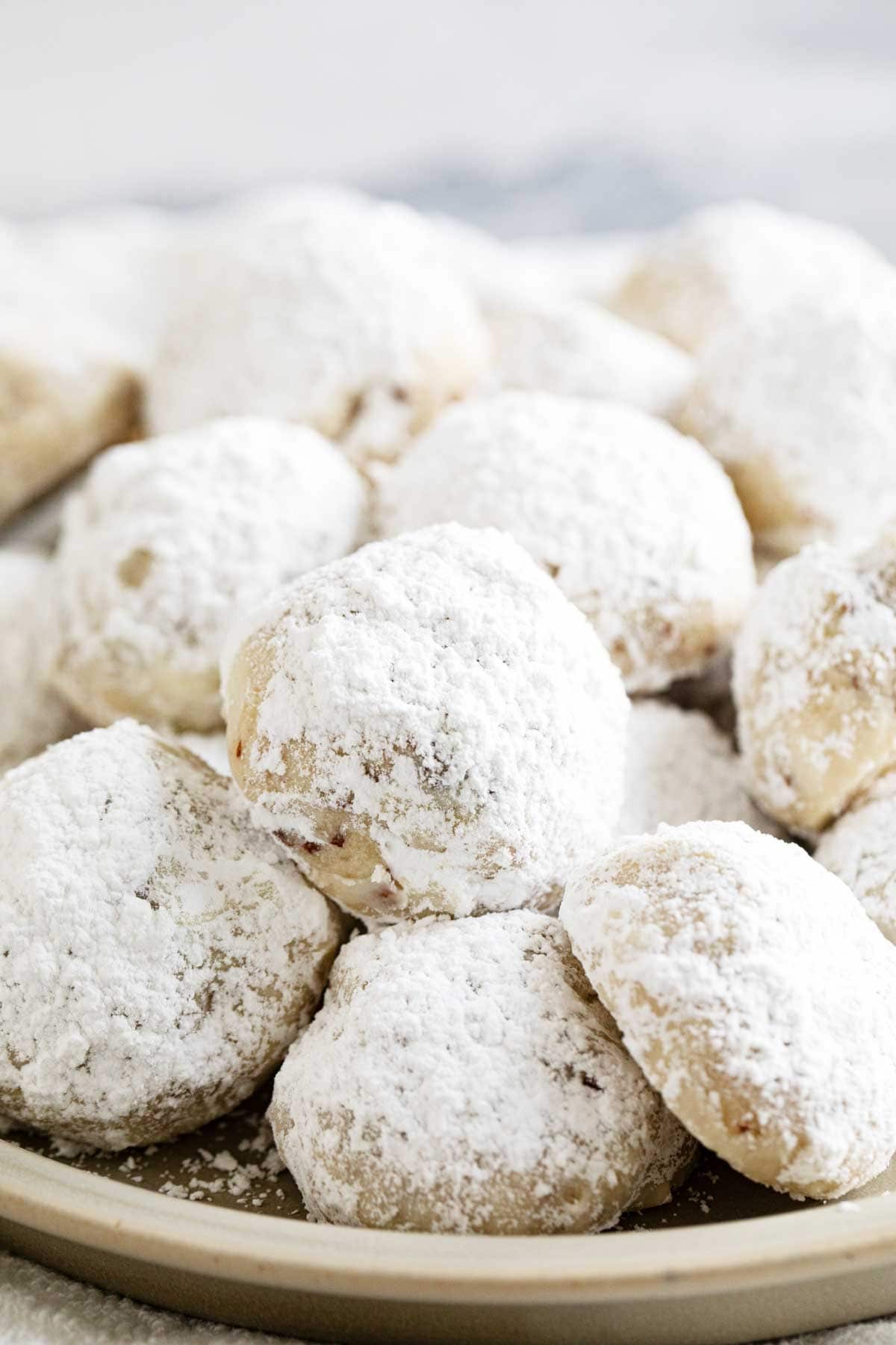 Snowball cookies dusted with powdered sugar.