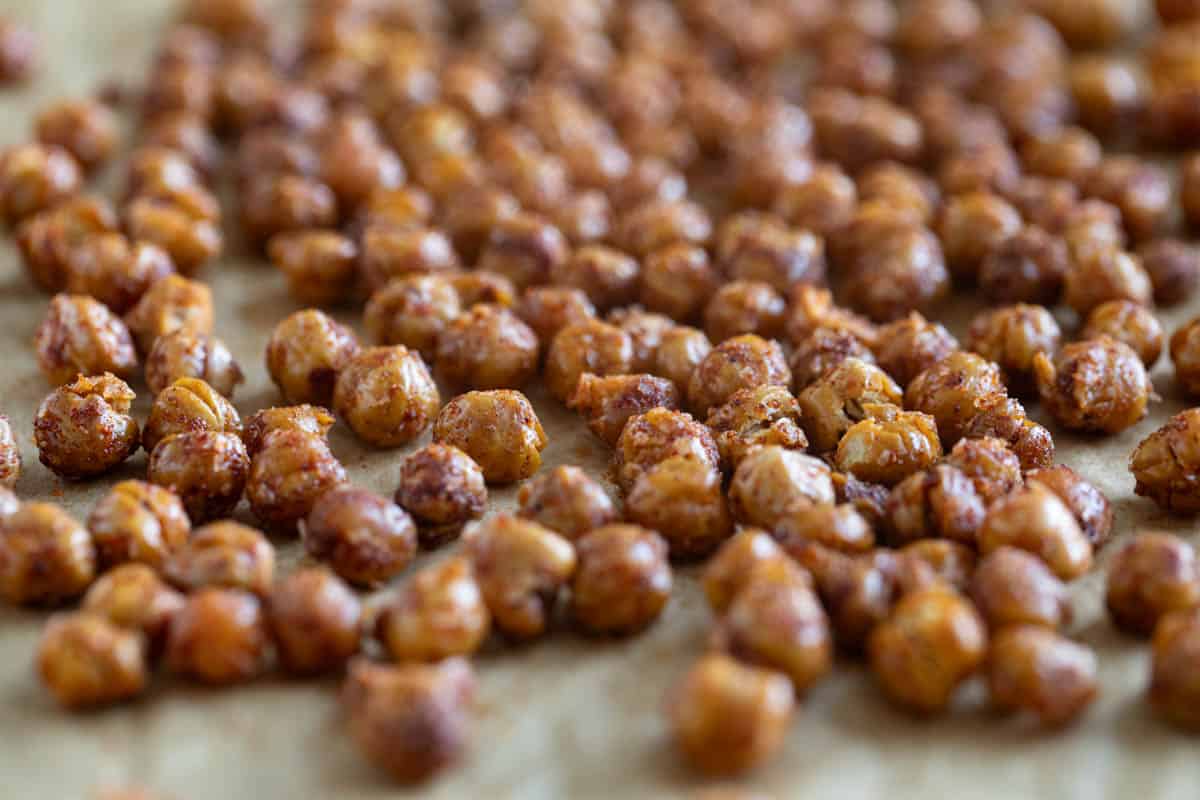 Roasted chickpeas on parchment paper.