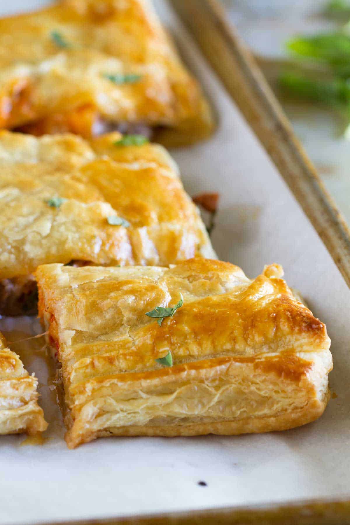 Sausage and Butternut Squash Slab Pie cut into slices.