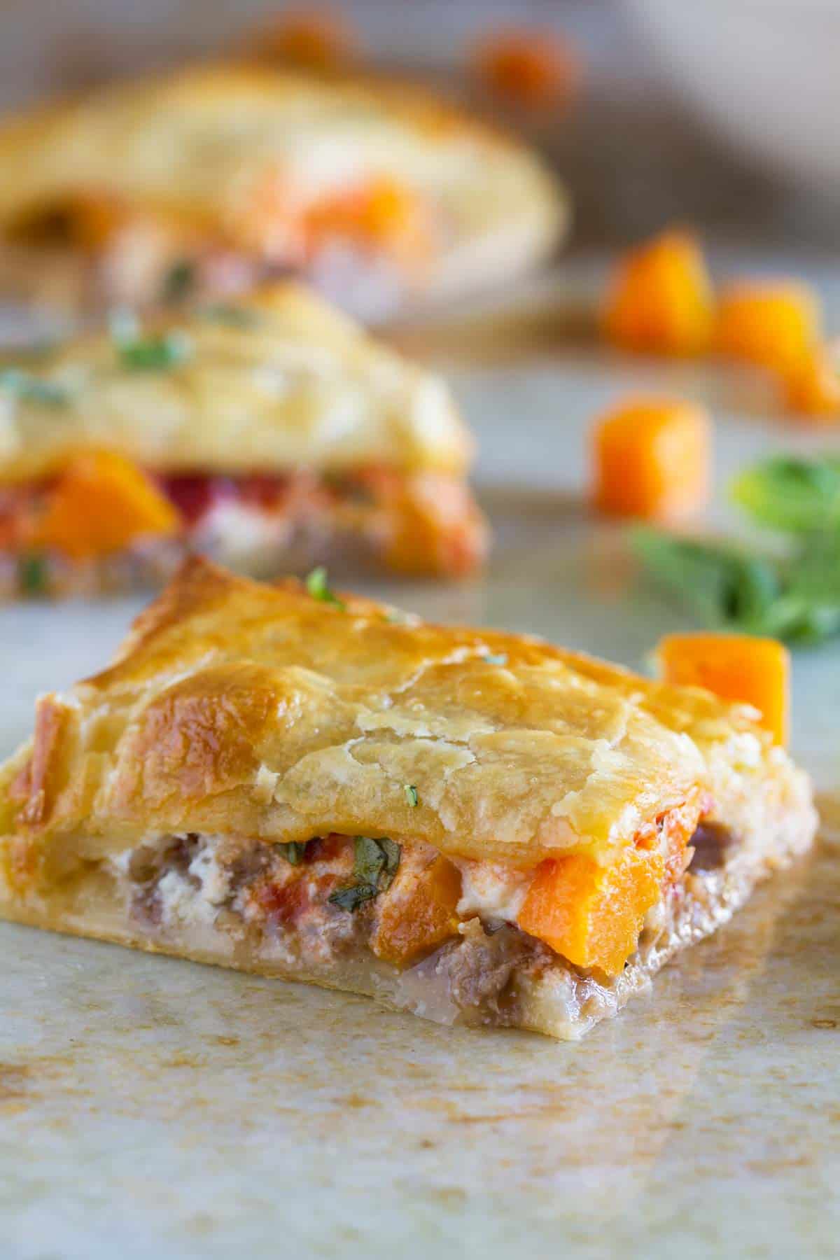 Slice of Sausage and Butternut Squash Slab Pie.