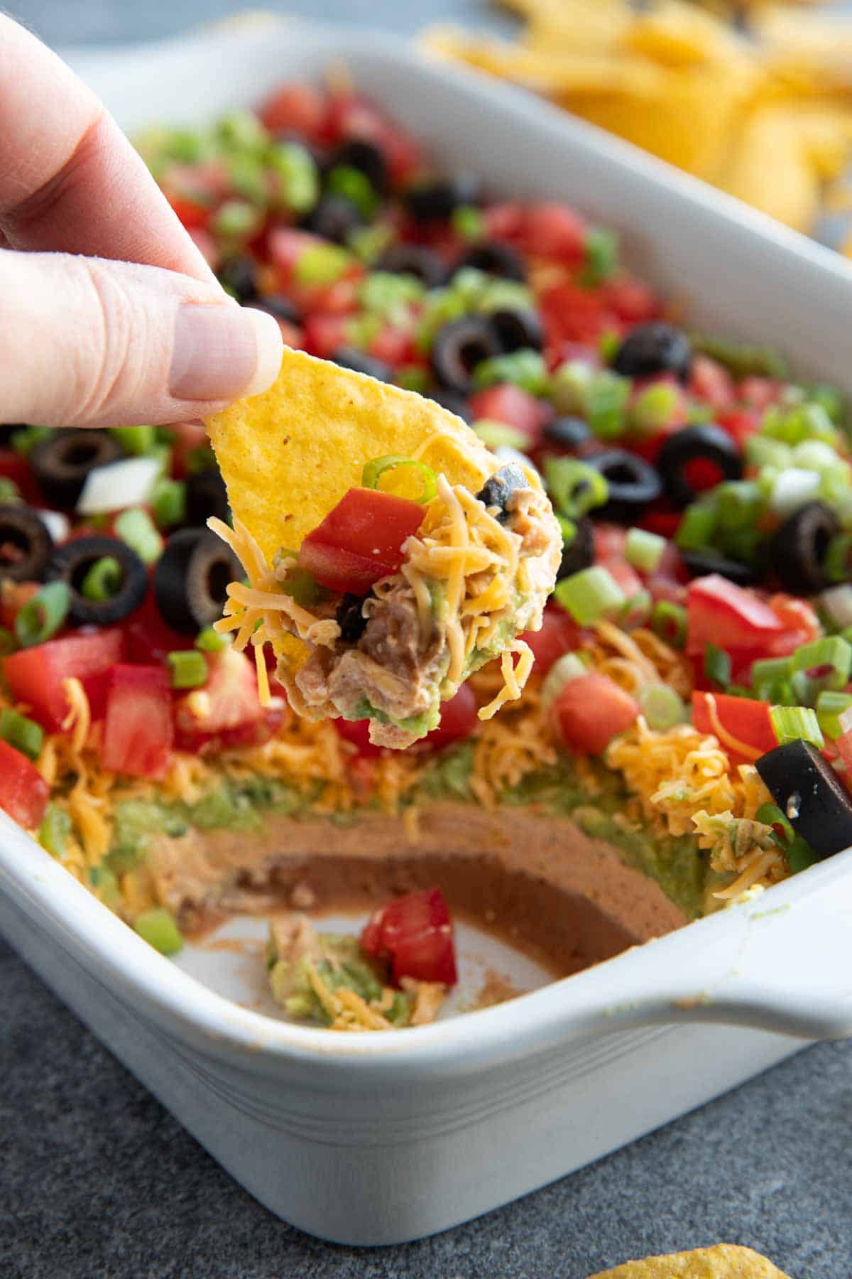 Tortilla chip with 7 layer dip.