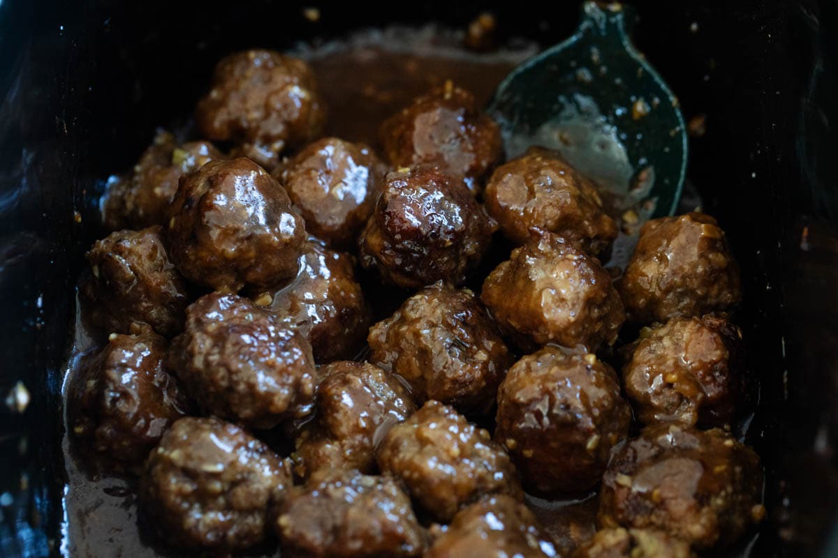 Asian meatballs with sauce in a crock pot.