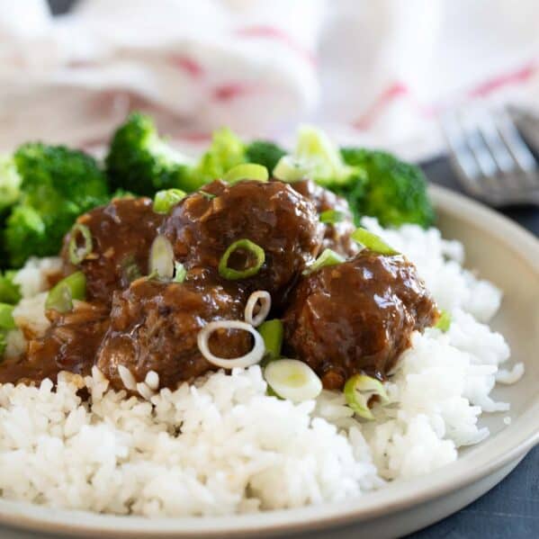 Asian meatballs over rice with steamed broccoli.