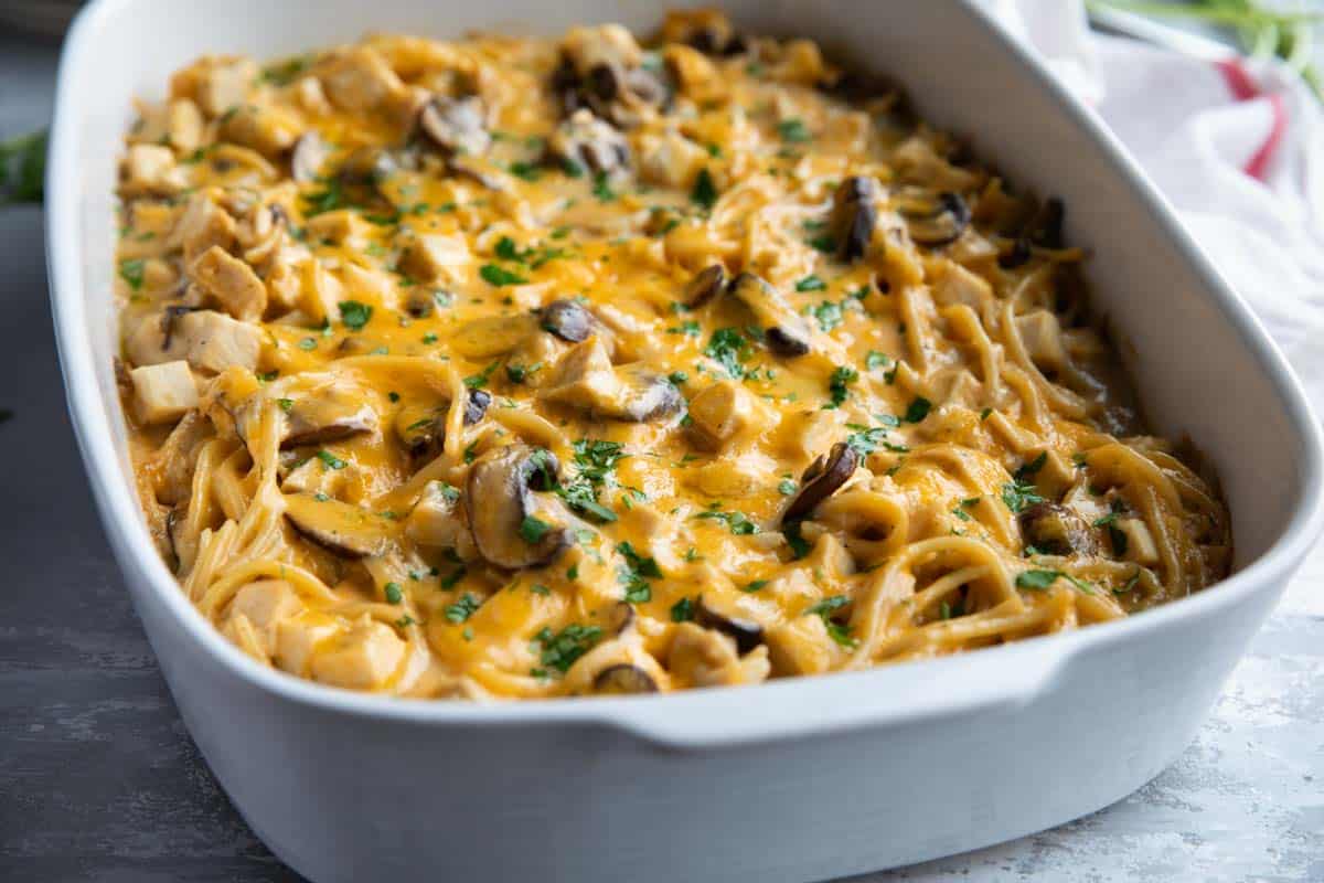 White casserole dish filled with chicken tetrazzini.