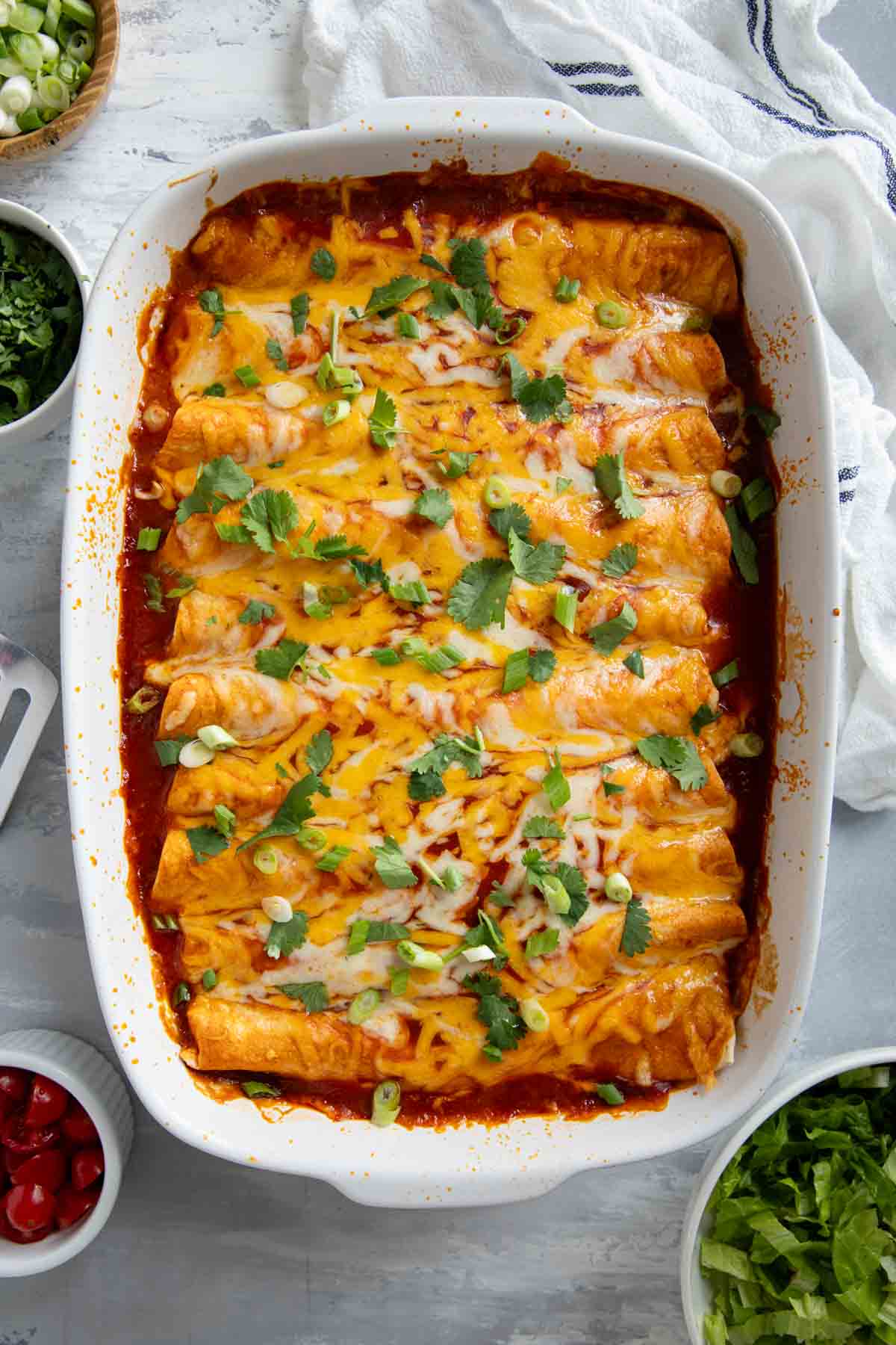 Casserole dish filled with ground beef enchiladas.