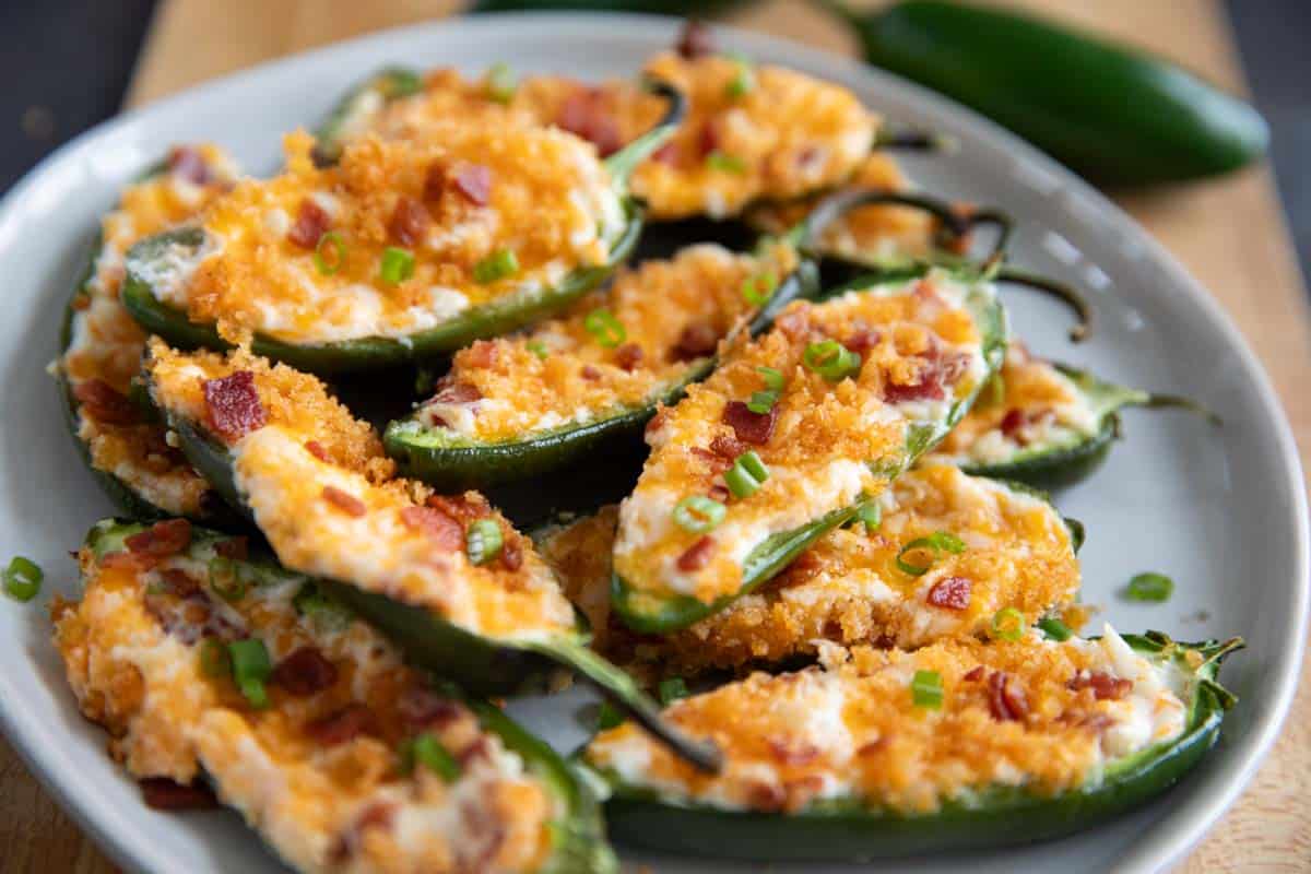 Jalapeño Poppers stacked on a plate for serving.