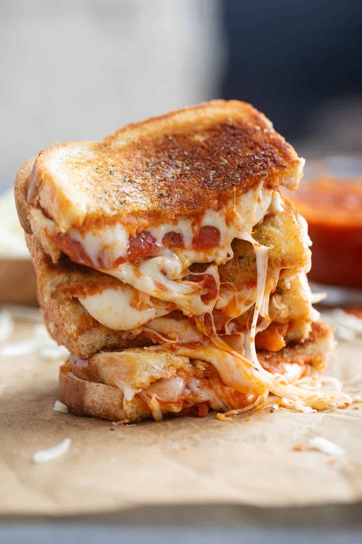 Pizza grilled cheese stacked on top of each other.