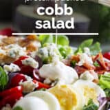 Protein packed Cobb salad with text overlay.