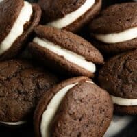 Whoopie pies stacked on a serving dish.