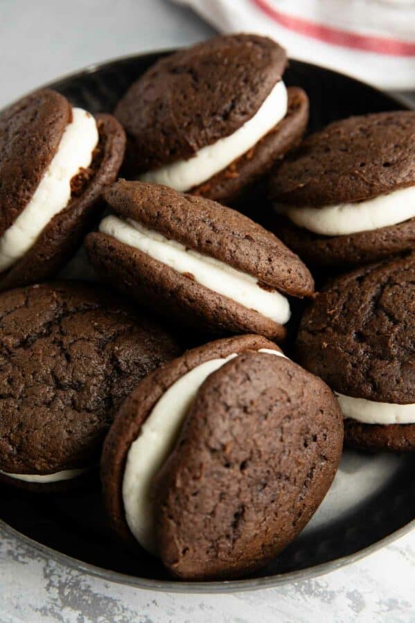 Whoopie pies stacked on a serving dish.
