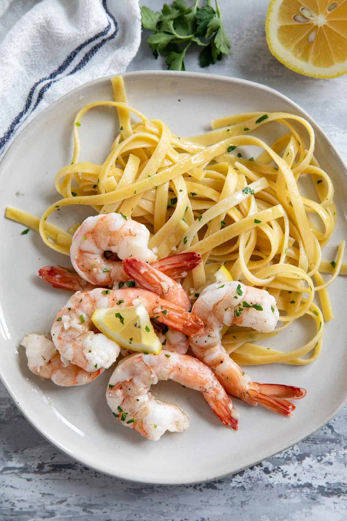 Baked shrimp with pasta on a plate.
