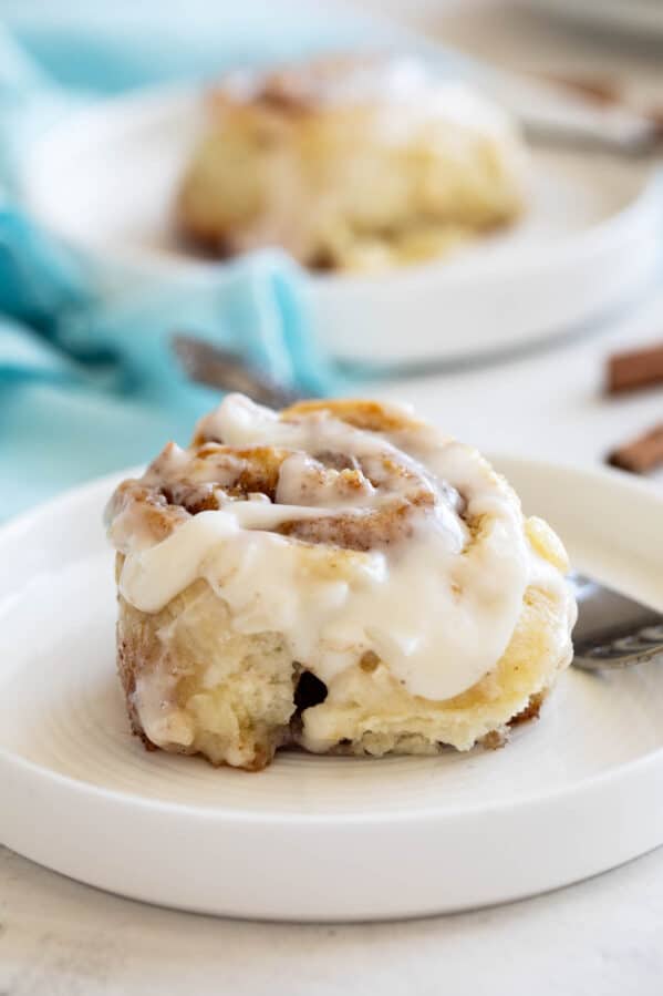 Cinnamon Biscuit on a plate, topped with icing.