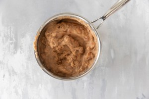Refried beans in a pan.