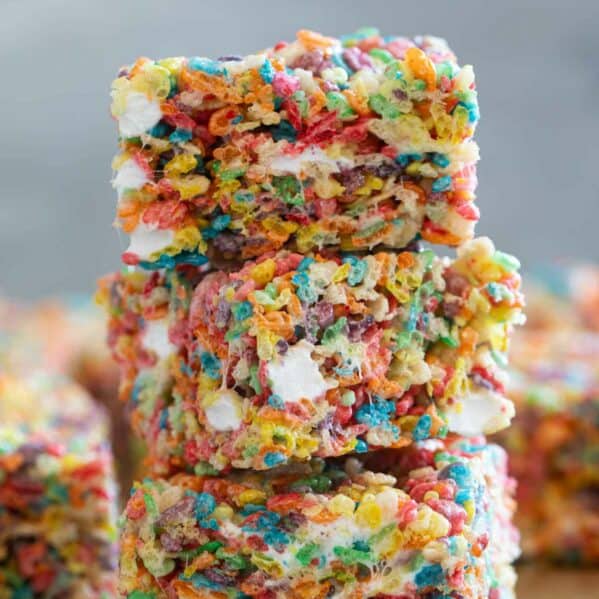 Fruity Pebble Rice Crispy Treats stacked on top of each other.