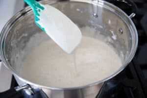 Making marshmallow mixture for fruity pebble rice crispy treats.