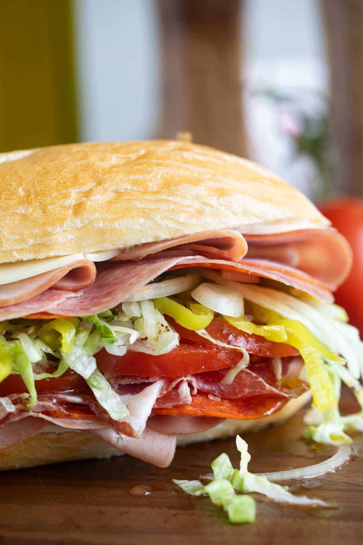 Italian Sub filled with meat and vegetables.