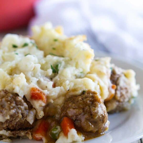 Serving of meatball cottage pie on a plate.