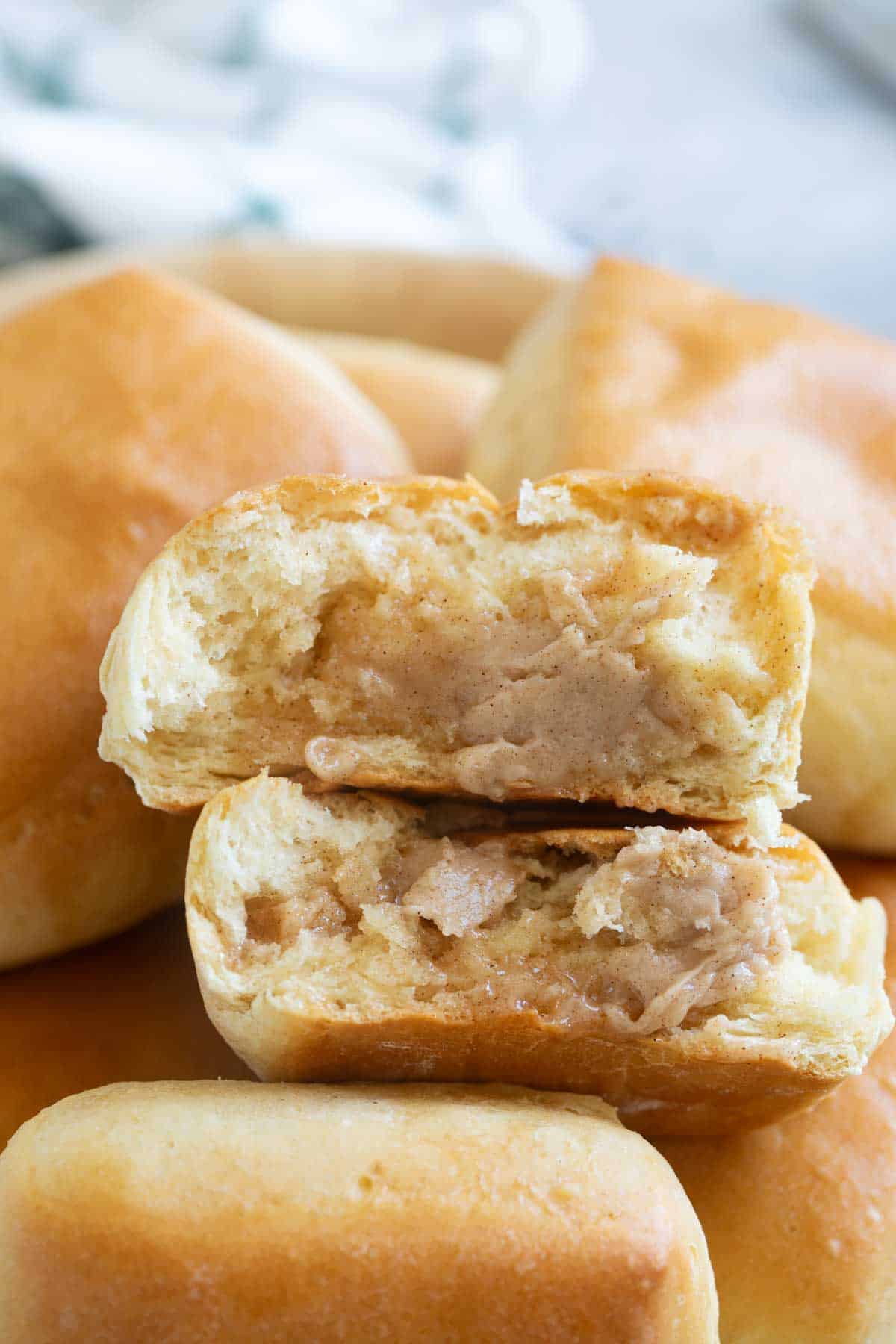 Texas Roadhouse Roll copycat split in half with with cinnamon honey butter spread over.