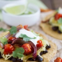 Vegetarian Tostadas made with black beans, spaghetti squash, onions, and tomatoes.