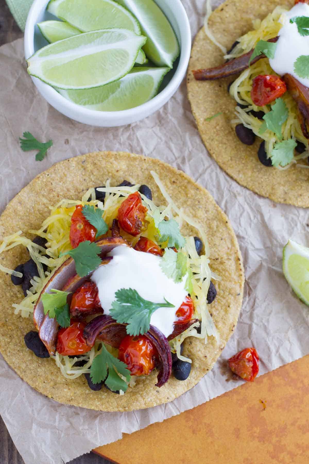 Vegetaran Tostadas topped with sour cream and cilantro.