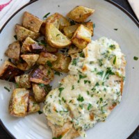 Chicken breast topped with creamy artichoke topping and served with roasted potatoes.