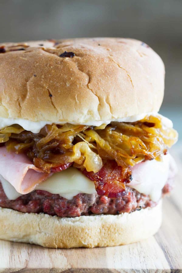 Triple Pork Burger - made with ground pork and topped with ham, bacon, and caramelized onions.