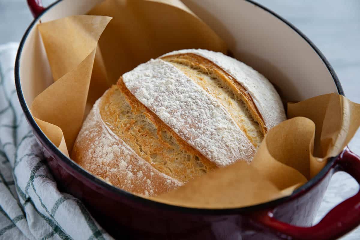 Loaf of artisan bread in a Dutch oven.