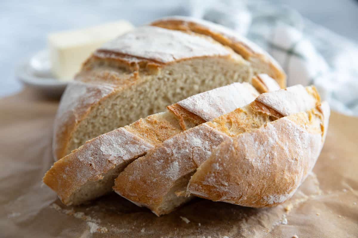 Loaf of artisan bread cut into slices.