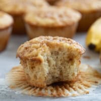 Banana toffee muffin with a bite taken out of it.