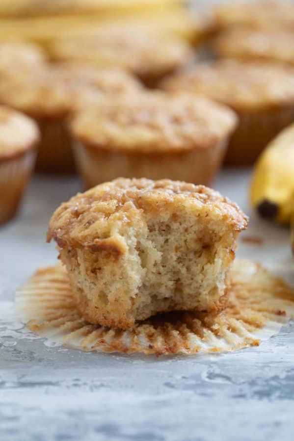 Banana toffee muffin with a bite taken out of it.