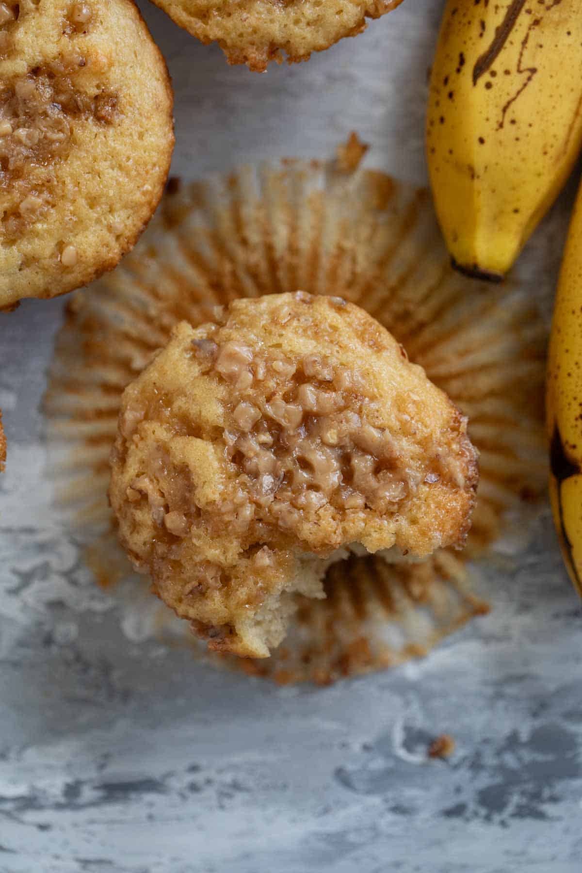 Banana Toffee Muffin topped with toffee bits.