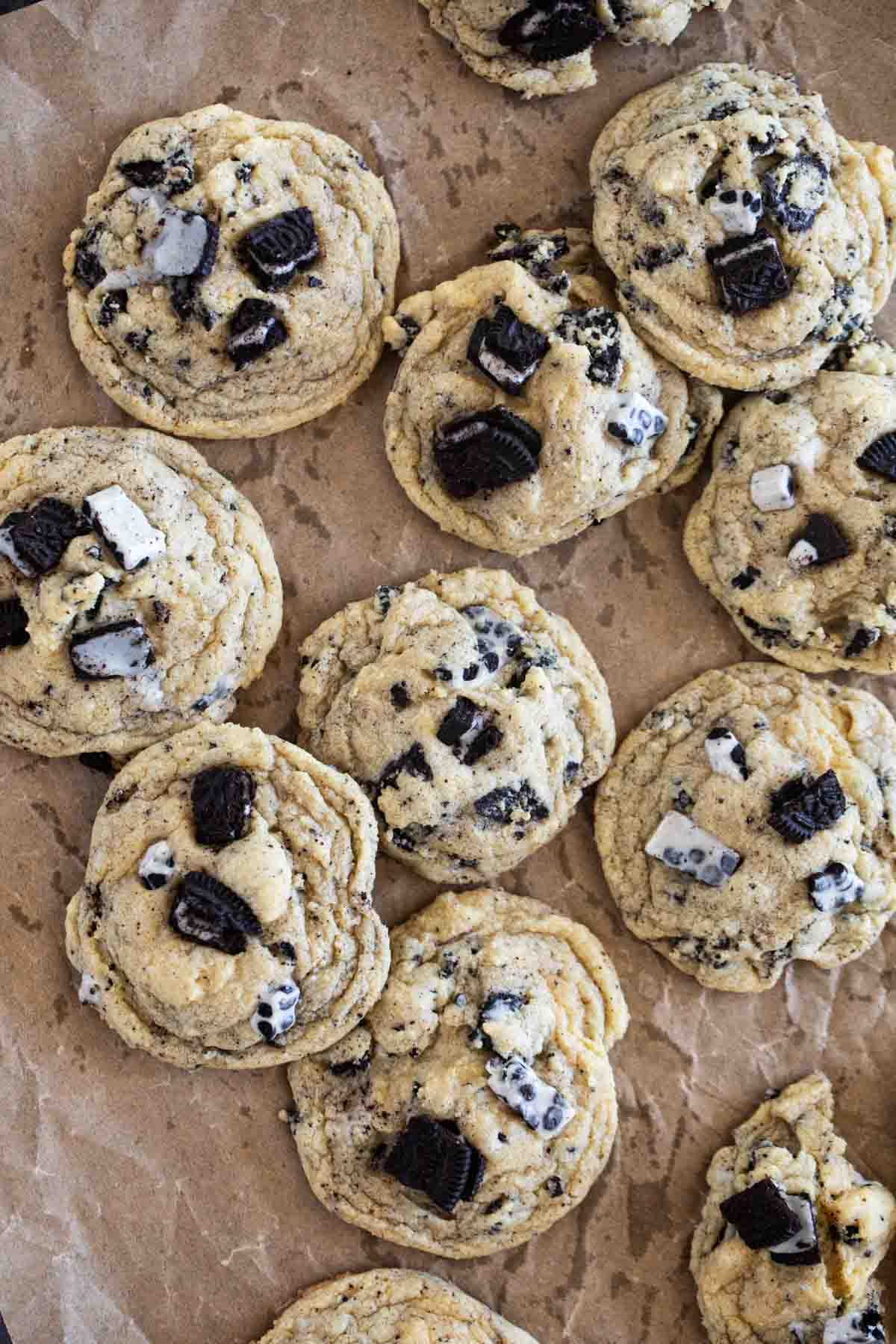 Cookies and Cream Cookies stacked on parchment paper.