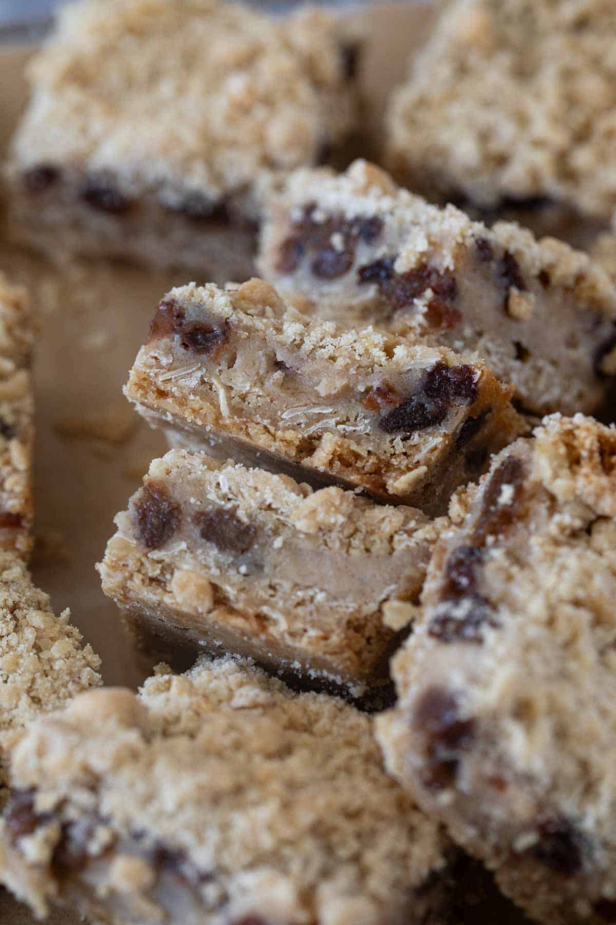 Oatmeal Raisin Bars with creamy raisin center stacked.