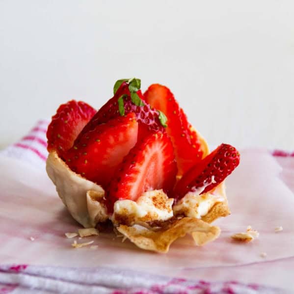 Strawberry Wonton Cup with the side broken to show filling.