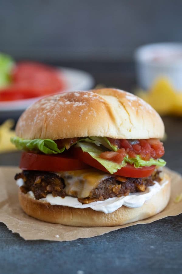 Taco burger topped with cheese.