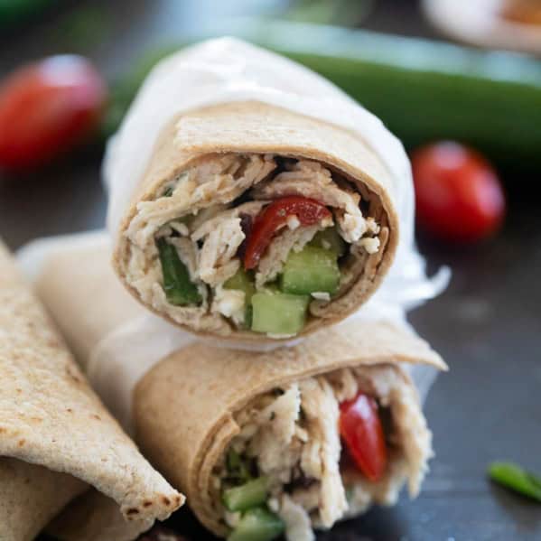 Greek Chicken Wraps with tomatoes, cucumbers, and olives.