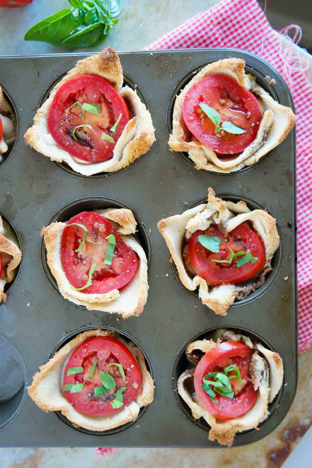 Mini Caprese Tarts in a muffin tin.